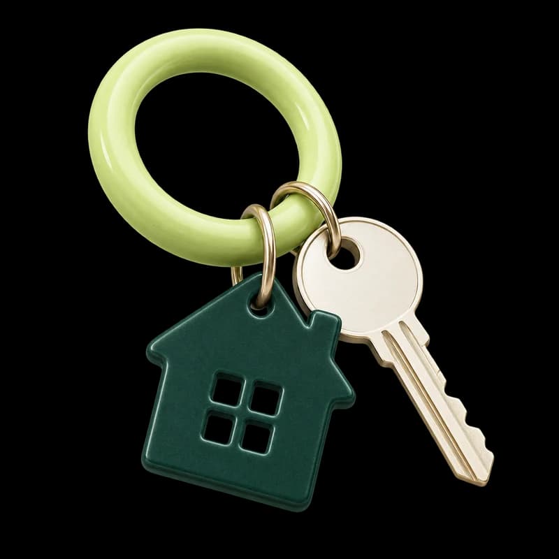 A green house charm and ivory key on a lime keyring